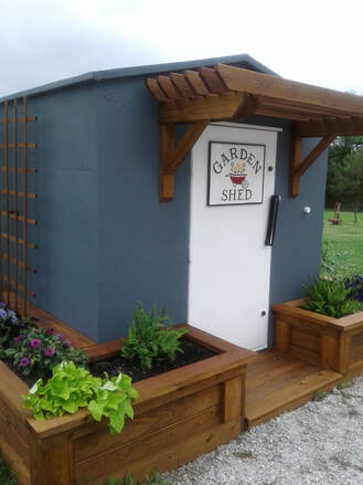 Storm shelter with planter boxes